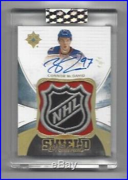 2016-17 Ultimate Collection Connor McDavid 2nd Year Game Used Shield Auto 1/1