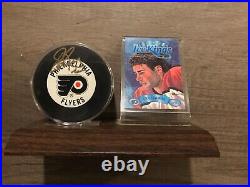 Eric Lindros signed NHL puck and Donruss ice kings 1994 card